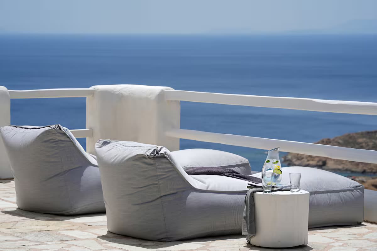 Loungers on the terrace, looking out to sea